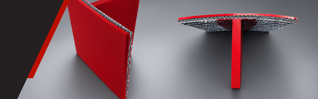 Cross section of high visibility red T-Scale seal with urethane cleat